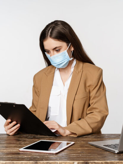 covid pandemic office workplace concept portrait corporate woman medical face mask from coronavirus working standing white background scaled